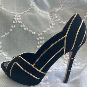 BCBG black velvet 4 1/2” heel with gold accents.